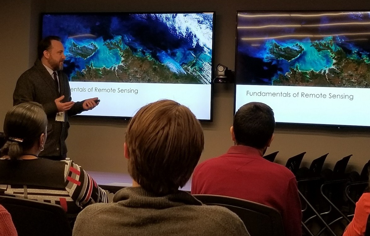SSAI's Brock Blevins leads a "Fundamentals of Remote Sensing" class for SSAI employees to share knowledge about its many applications for future research.